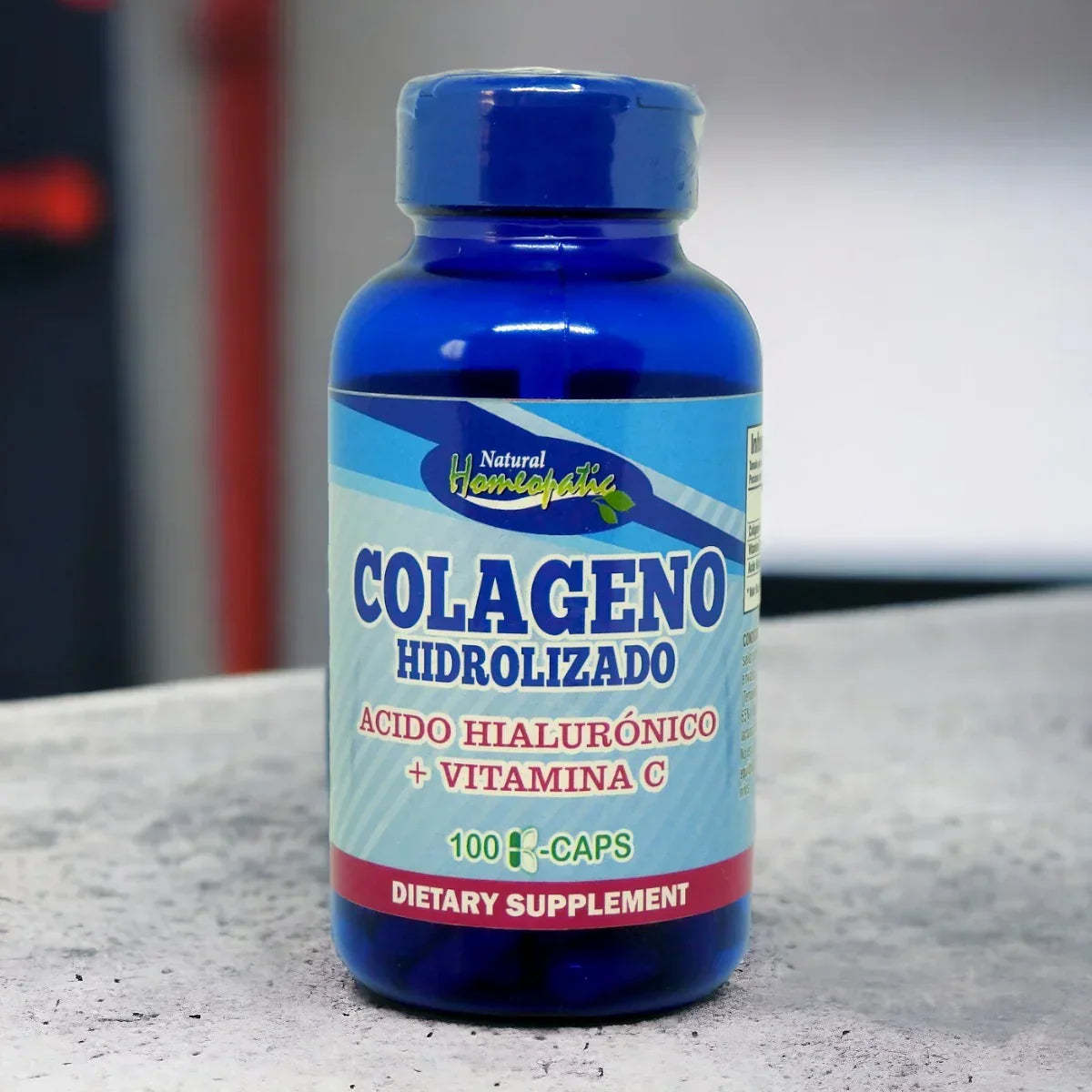Botella azul de suplemento dietario colágeno hidrolizado con ácido hialurónico y vitamina C